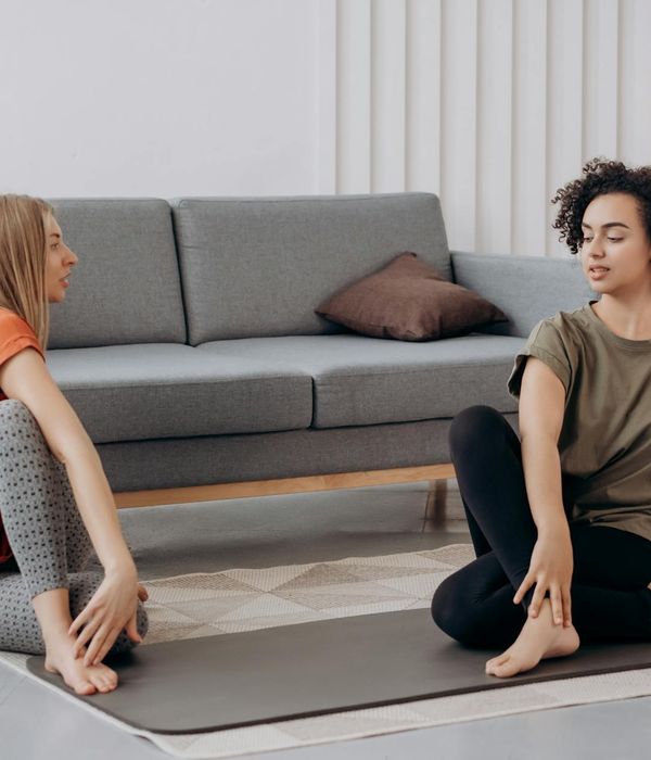 Person performing a gentle yoga stretch, focusing on flexibility and inner calm.